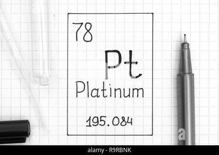 The Periodic table of elements. Handwriting chemical element Platinum Pt with black pen, test tube and pipette. Close-up. Stock Photo