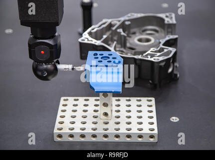 CNC Coordinate Measuring Robotic Machine measuring workpiece Stock Photo