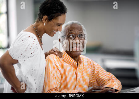 Husband and wife do taxes together. Stock Photo