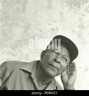 Front view of an elderly man trying to listen closely. Stock Photo