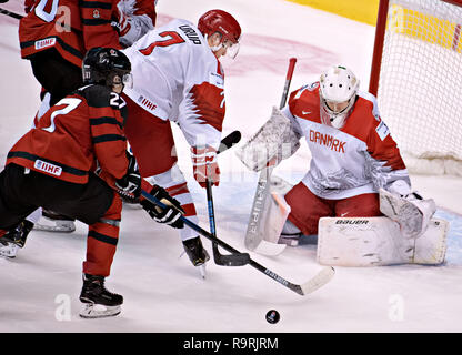 Vancouver. 26th Dec, 2018. Denmark's goalie William Rorth (R) and teammate Jeppe Morgensen tries to stop Canada's Barrett Hayton from scoring during the IIHF World Junior Championships in Vancouver, Dec. 26, 2018. Canada won the preliminary match 14-0. Credit: Andrew Soong/Xinhua/Alamy Live News Stock Photo