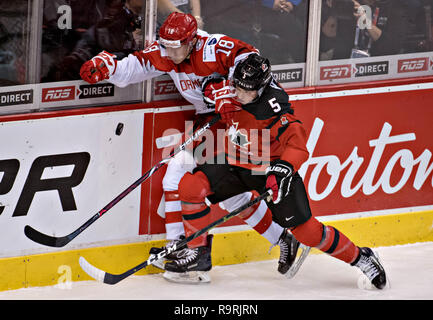 Vancouver. 26th Dec, 2018. Denmark's Jakob Wittendorf (L) and Canada's Ian Mitchell compete during the IIHF World Junior Championships in Vancouver, Dec. 26, 2018. Canada won the preliminary match 14-0. Credit: Andrew Soong/Xinhua/Alamy Live News Stock Photo