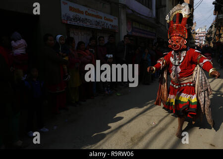 Bhaktapur, Nepal. 28th Dec, 2018. A masked dancer chases people during Navadurga festival in Madhyapur Thimi on Friday, December 28, 2018. Credit: Skanda Gautam/ZUMA Wire/Alamy Live News Stock Photo