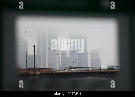 Frankfurt am Main, Germany. 29th Dec 2018. A 'show window' on the banks of the Main provides a view of the bank towers, the tops of which are covered in fog. Photo: Arne Dedert/dpa Credit: dpa picture alliance/Alamy Live News Stock Photo