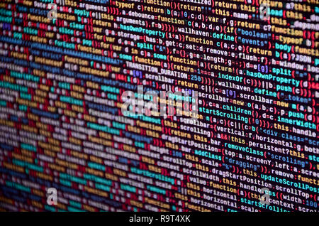 Software developer programming code on computer. Abstract computer script source code. Shallow depth of field, selective focus effect Stock Photo