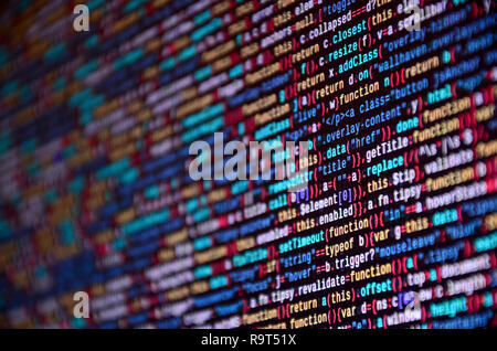 Software developer programming code on computer. Abstract computer script source code. Shallow depth of field, selective focus effect Stock Photo