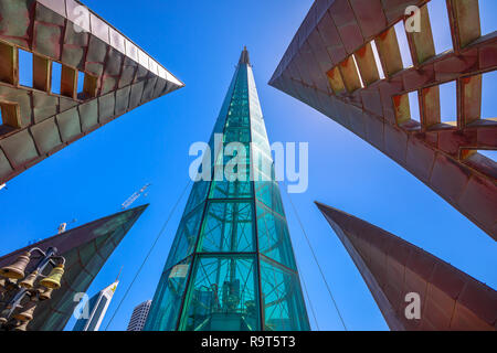Perth, Australia - Jan 3, 2018: bottom view of iconic glassed tower and tall skyscrapers of Elisabeth Quay in the blue sky. Architecture background. Landmarks in Perth City, Western Australia. Stock Photo