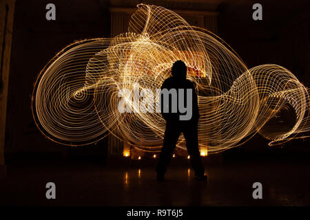 Human silhouette against backlight. Light painting photography. abstract shapes demarcate man. Stock Photo