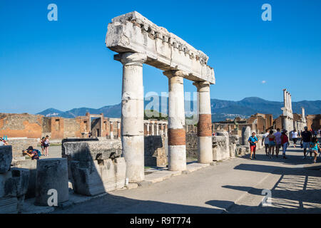 Tourists visiting Roman Forum, Colonnade, Pompeii, Campania Italy, pompeii ruins UNESCO site, roman concept, history, archeology, europe, top sites Stock Photo