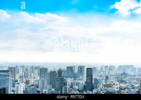 Asia Business concept for real estate and corporate construction - panoramic urban city skyline aerial view under bright blue sky and sun in Tokyo, Ja Stock Photo