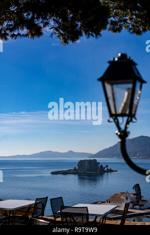 Two small islands, Vlaherna and Mouse Island with Christian churches in Corfu, Kerkyra, Greece, sunny spring day view from high above with blurred str Stock Photo