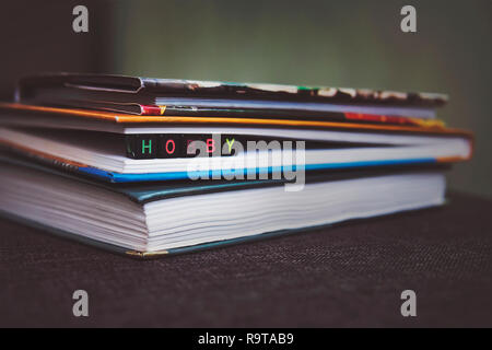 Books are close-up. A stack of books with the inscription on the cubes, Hobbies reading books Stock Photo