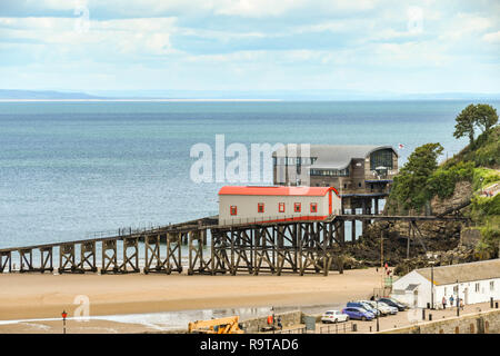 TENBY, PEMBROKESHIRE, WALES - AUGUST 2018: The old lifeboat station in the foreground and the new lifeboat station in the background in Tenby, West Wa Stock Photo