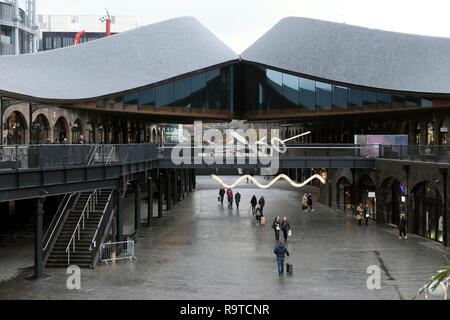 People shopping at Coal Drops Yard in the Kings Cross redevelopment area of London UK  KATHY DEWITT Stock Photo