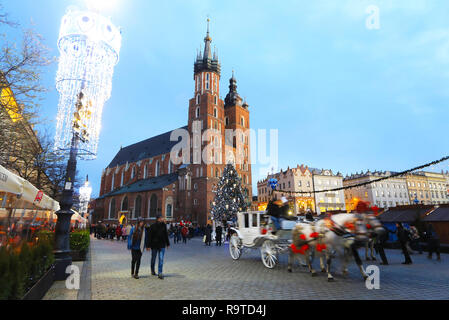 The landmark St Mary's Church with it's two unequal towers, on the Market Square, in the Old Town, in Krakow, Poland