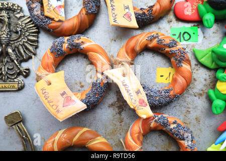 Fridge magnets for sale on stalls on the Christmas market in the Main Market Square, in the Old Town in Krakow, Poland Stock Photo