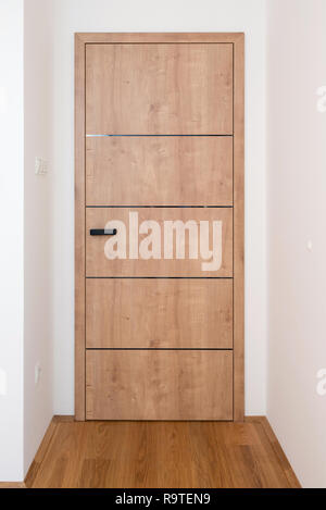 Wooden door in modern house Stock Photo