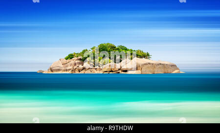 Tropical island in ocean - vacation background, Long exposure, blur motion, Seychelles Stock Photo