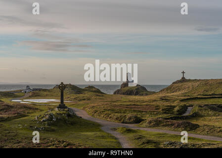 The Llanddwyn island lighthouse, Twr Mawr at Ynys Llanddwyn on Anglesey, North Wales at sunrise. Stock Photo