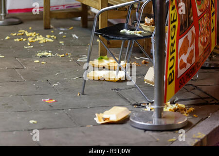 Pictured: Discarded take-away food on the pavement. Friday 14 December 2018 Re: Revellers in Wind Street, Swansea, Wales, UK. Stock Photo