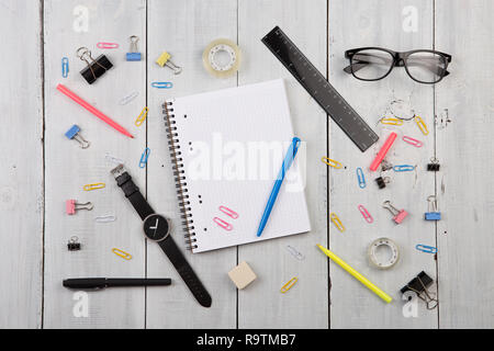 workplace with notepad, glasses, watch, pen etc. Stock Photo