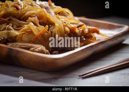 Authentic stir fried Korean chicken bokkeum with grilled carrots cabbage and onions Stock Photo