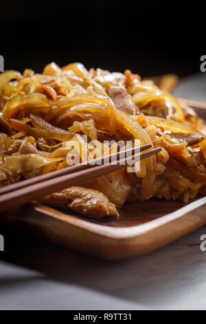 Authentic stir fried Korean chicken bokkeum with grilled carrots cabbage and onions Stock Photo