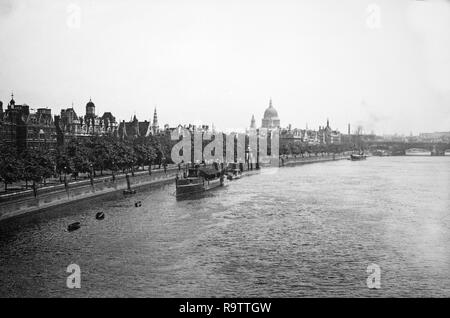 View of the River Thames in London, taken in 1919. View is looking East with Saint Pauls Cathedral visible on the skyline. Stock Photo