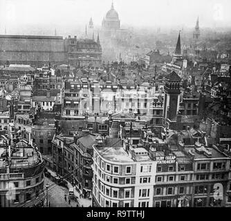 Early twentieth century black and white photograph taken from the top of The Monument in Central London, looking West over the rooftops of the city, with St. Pauls Cathedral on the skyline. Stock Photo