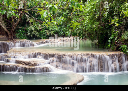 Kuang Si Waterall near Luang Prabang, Laos - Exotic cascading pools of travertine turquoise blue water in Asia Stock Photo