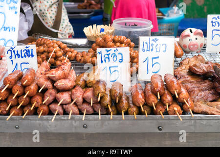 Street Food in Phuket, Thailand - Fried meats with sticks, Thai style food Stock Photo