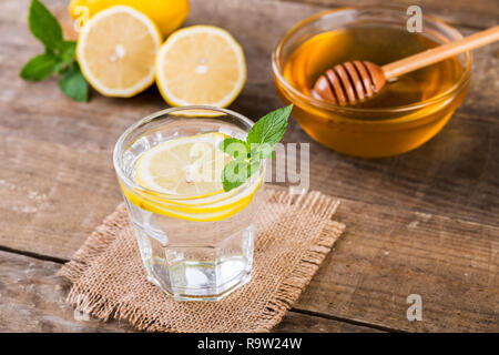 Honey and Lemon Drink. Detox water with honey, lemon and mint, Health and Organic. Stock Photo