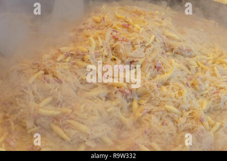 Finger-shaped potato dumplings, Schupfnudeln with cabbage and bacon on the Baden-Baden Christmas market, Baden-Baden, Baden-Wuerttemberg, Germany, Eur Stock Photo