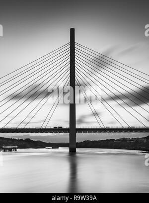 A black & white fine art long exposure of the new Northern Spire bridge spanning the river Wear in Sunderland. Stock Photo