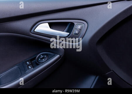 Detail of the interior of the front door of a modern car. Stock Photo