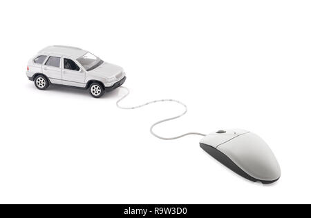 Small silver car connected to computer mouse Stock Photo