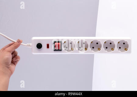 power extension cord with on-off switch in hand Stock Photo