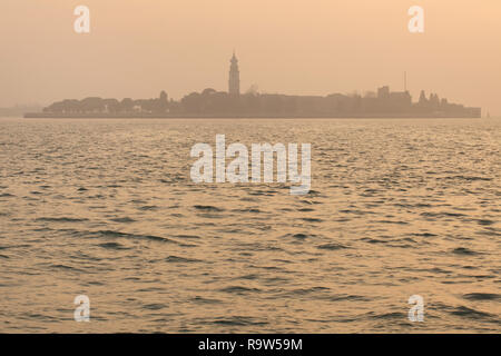 Sunset over San Lazzaro degli Armeni in the Venetian Lagoon (Laguna di Venezia) near Venice, Italy. Stock Photo