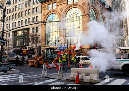 New York City, USA - Nov 2017: Men at work on the road in Manhattan Stock Photo