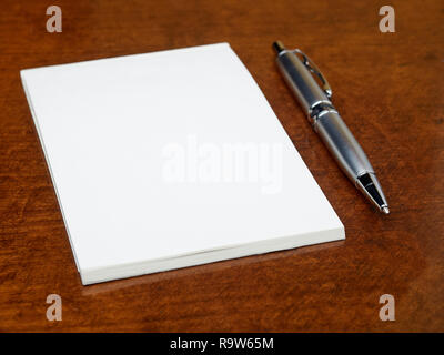 Blank notebook and pen on the table Stock Photo
