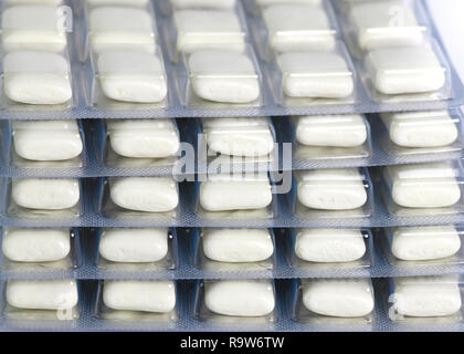 close up of a pile of nicotine gum for giving up smoking for health reasons  isolated on a white background Stock Photo