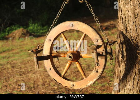 antique lamp hanging on a tree Stock Photo