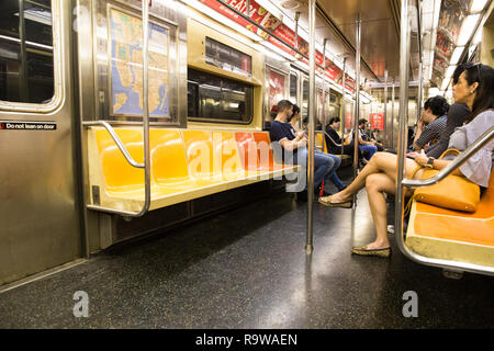 NEW YORK CITY - OCTOBER 6, 2017: View of commuters inside New York City MTA subway train in Manhattan Stock Photo