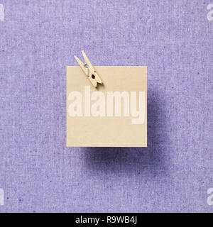 Empty memo paper, sticky notes on purple fabric background Stock Photo