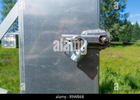 Padlocked metal box outside Stock Photo