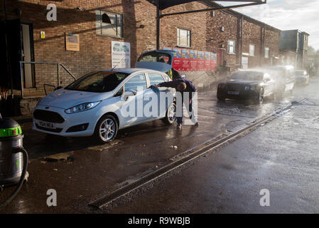 Car Wash in Saffron Walden Essex England UK. December 2018 Men from Moldava and Romania washing cars. Stock Photo