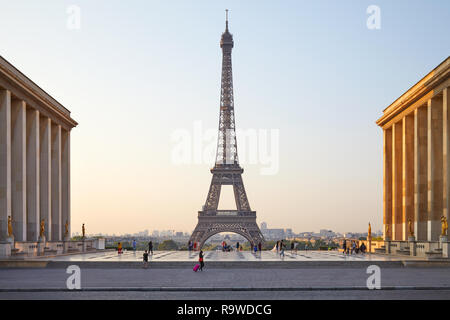 PARIS, FRANCE - JULY 7, 2018: Eiffel tower seen from Trocadero and people walking in the early morning, clear sky in Paris, France Stock Photo
