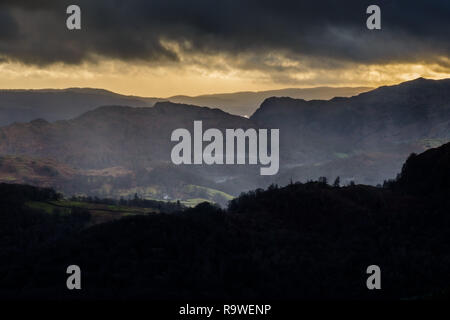 Rain passing through Langdale towards Windermere, seen from Silver How summit, near  Grasmere, Lake District, Cumbria Stock Photo