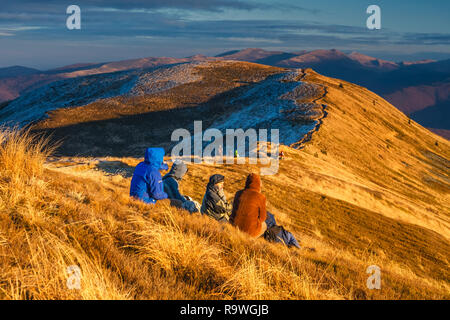 Wetlina, Poland, November 12, 2011:Group of people enjoy the sunset over Bieszczady Mountains, south east Poland Stock Photo