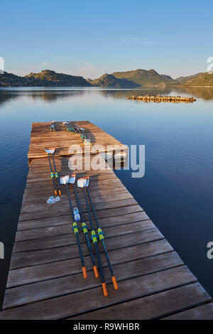 Oars for kayaks lie on the dock, the islands of Kekova at dawn, Turkey Stock Photo